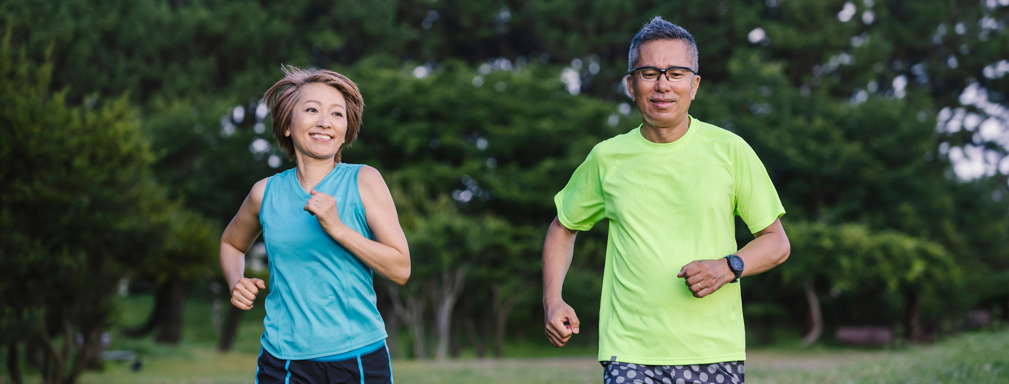 photo of a woman and a man jogging