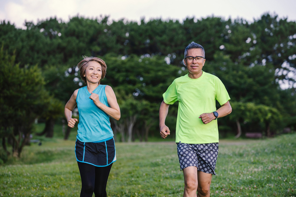 photo of a woman and a man jogging