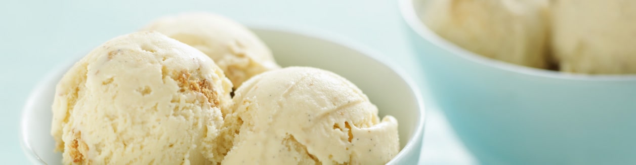 Photo of scooped ice creams going into a deep bowl.