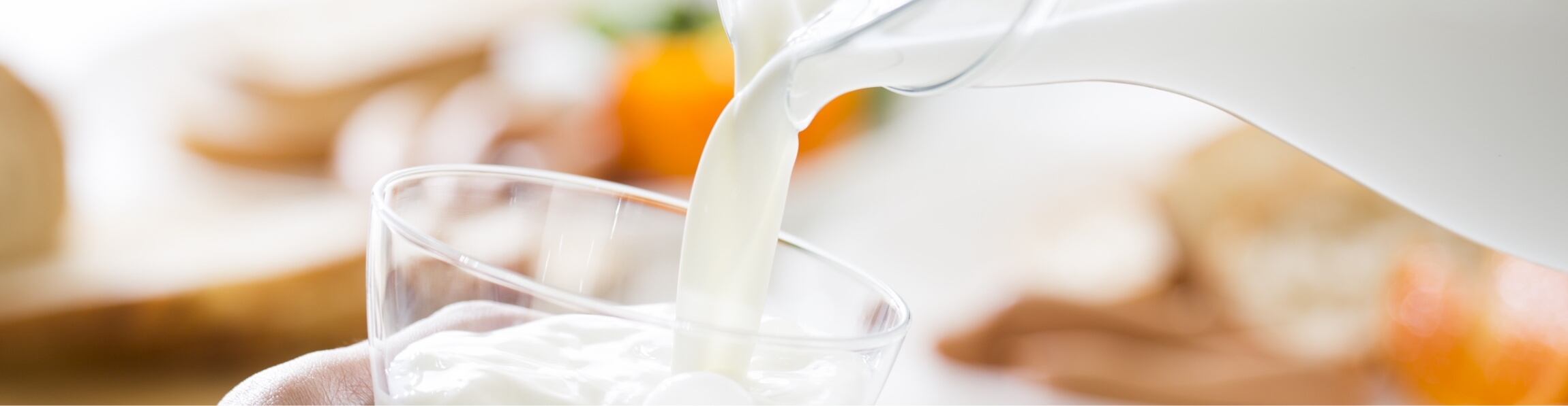 Photo of pouring milk into a glass