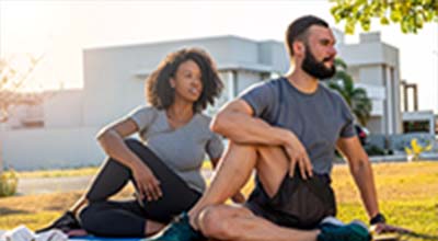 photo of a woman and a man exercising