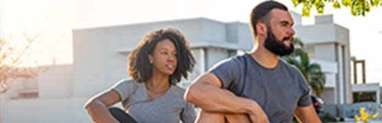 photo of a woman and a man exercising