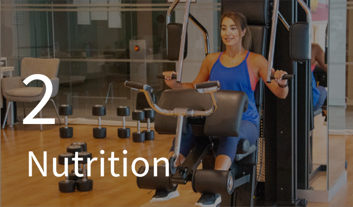 Photo of a woman working out on an exercise machine.