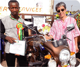 The winner, a cocoa Farmer (left)