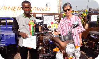 The winner, a cocoa Farmer (left)