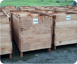 Cocoa fermentation boxes with Meiji logo