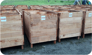 Cocoa fermentation boxes with Meiji logo