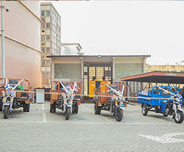 Tricycles Donated as Prizes (second and third from right)