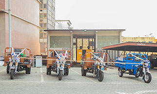 Tricycles Donated as Prizes (second and third from right)