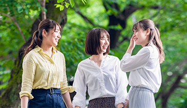 photo of three women laughing