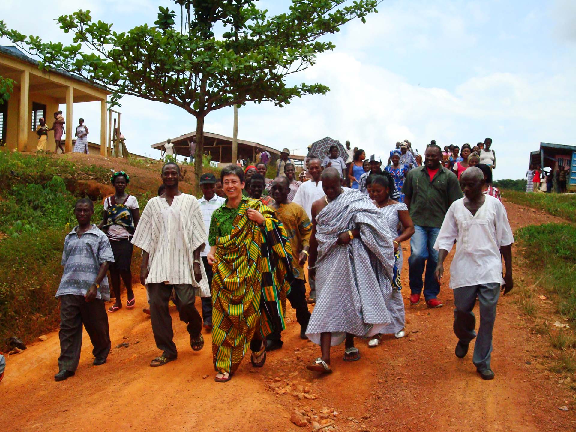 Photo: Meiji's Yoshinori Doi meeting villagers in Aserewadi, Ghana