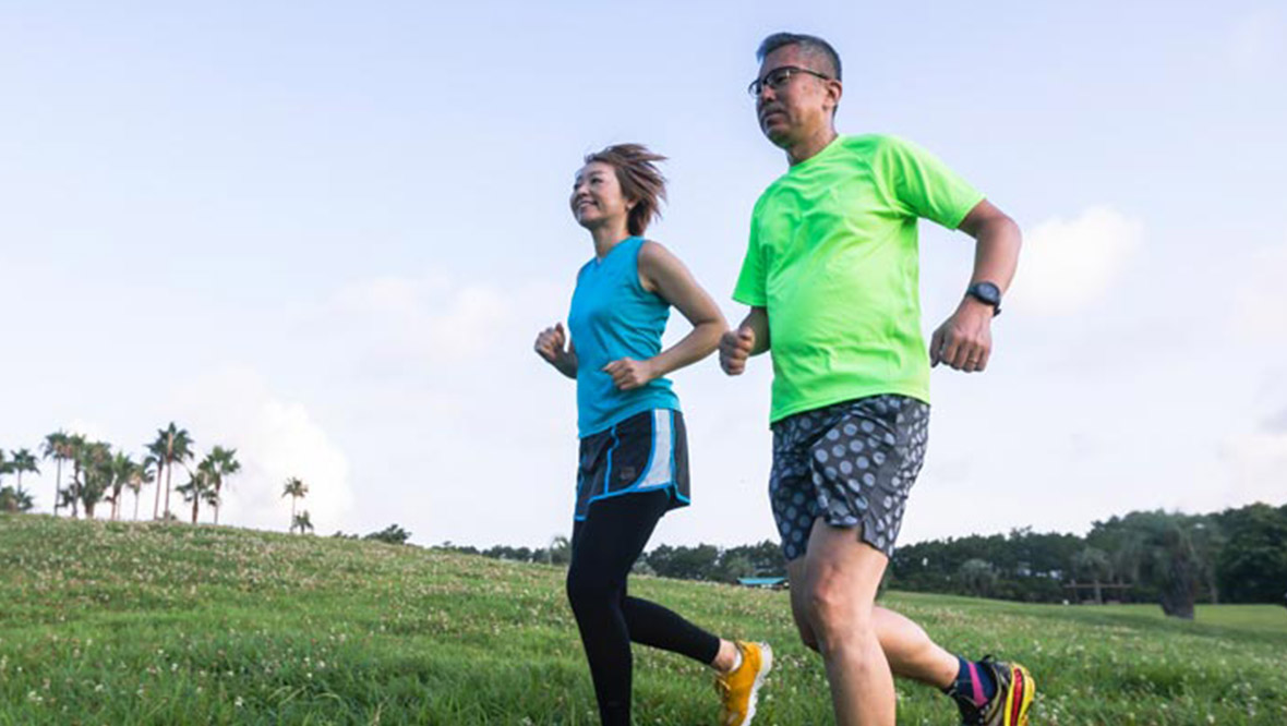 photo of a man and woman jogging together